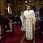 Parintele Catalin Constantin cadind biserica